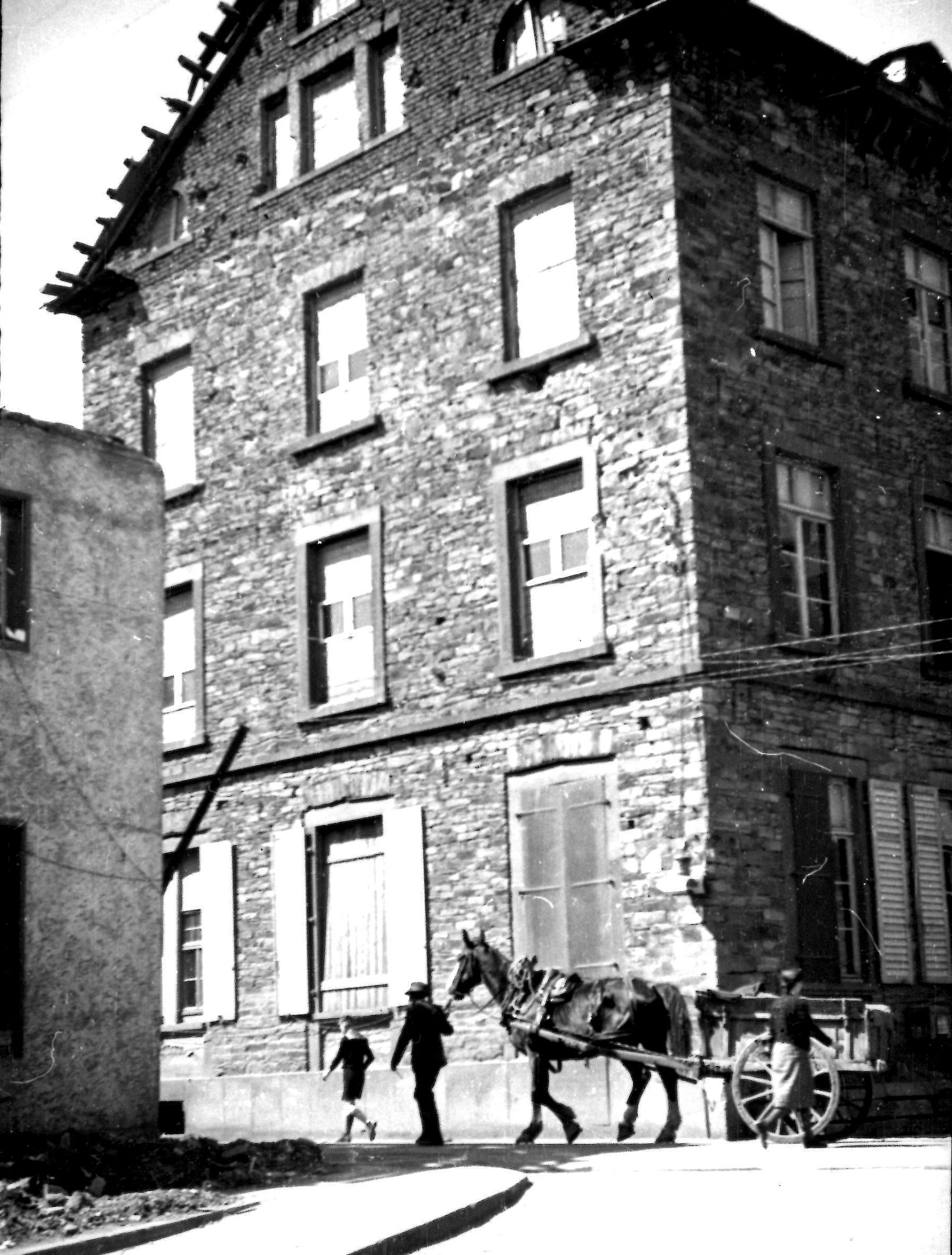 black and white image of a brick house