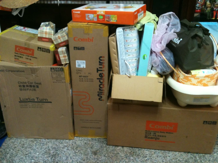 several boxes piled on top of each other with bags