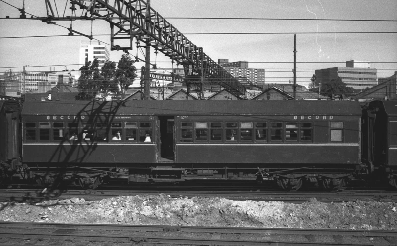 a black and white po of people standing on the train