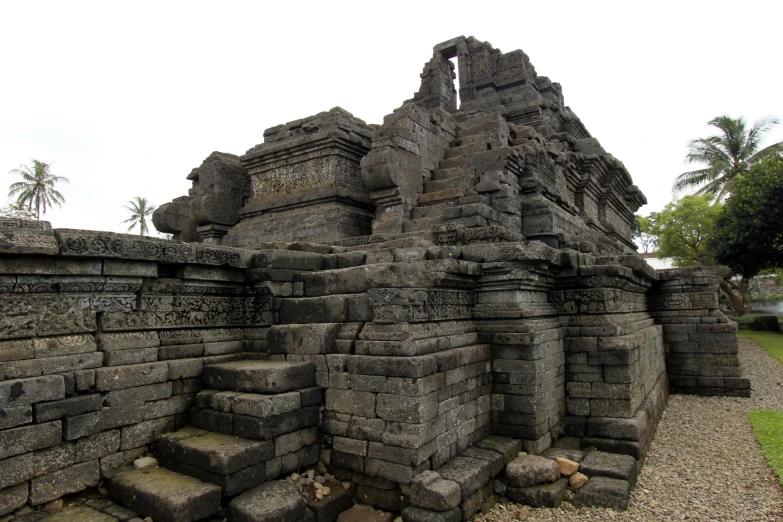 an ancient building made of stone with several levels