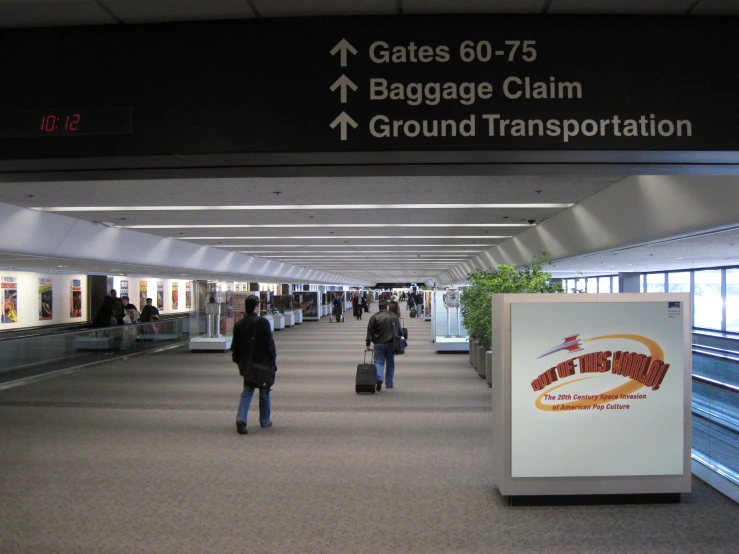 a very large airport terminal with many people