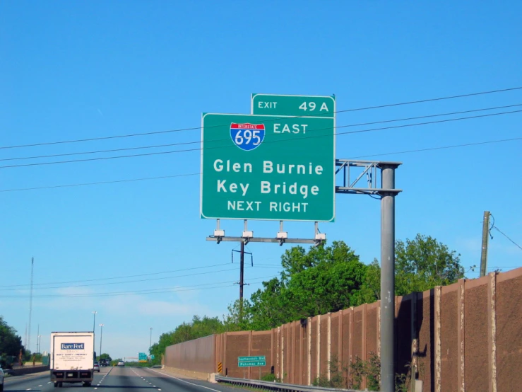 a highway sign at the corner of the freeway