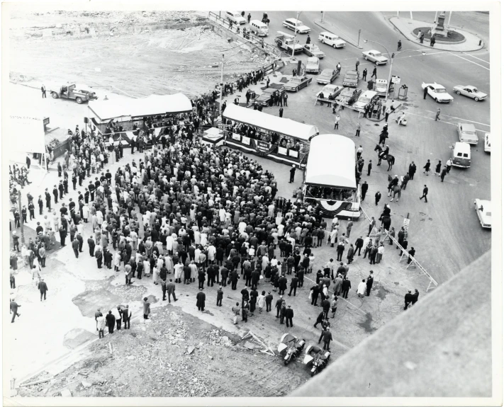 a crowd of people that are standing in the street