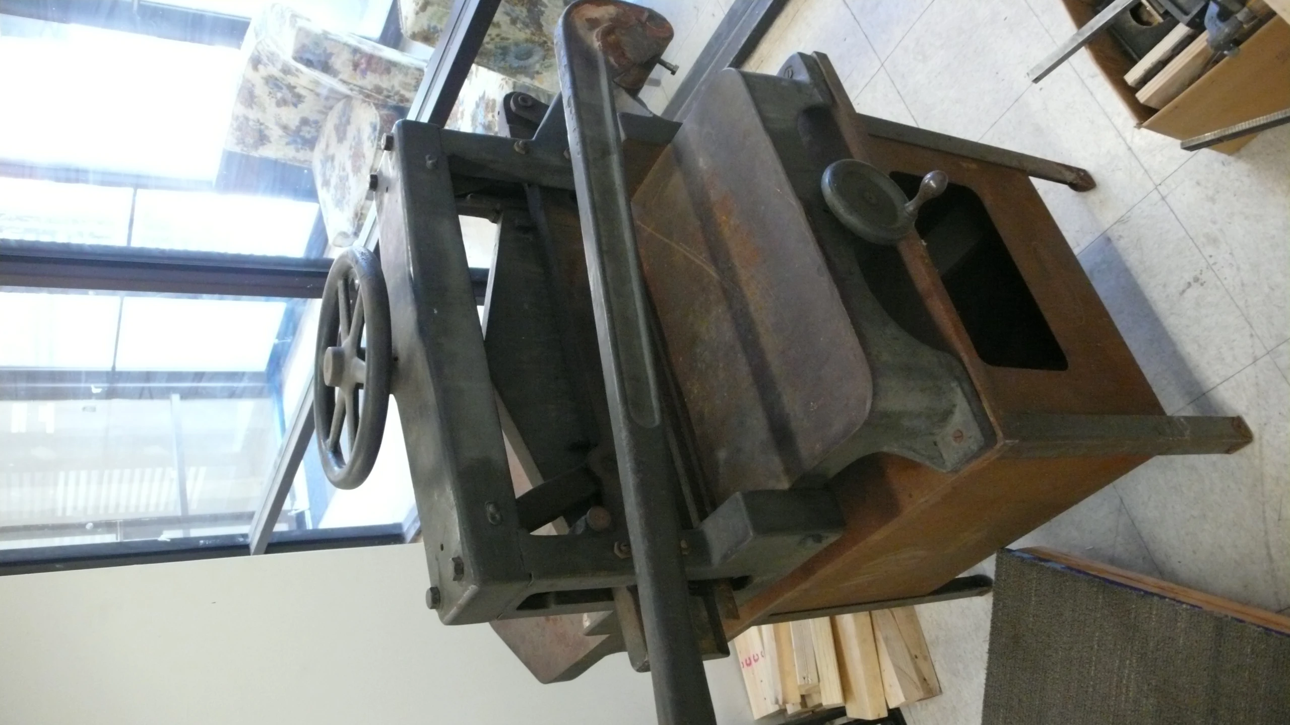 some very old stoves sit in front of a window