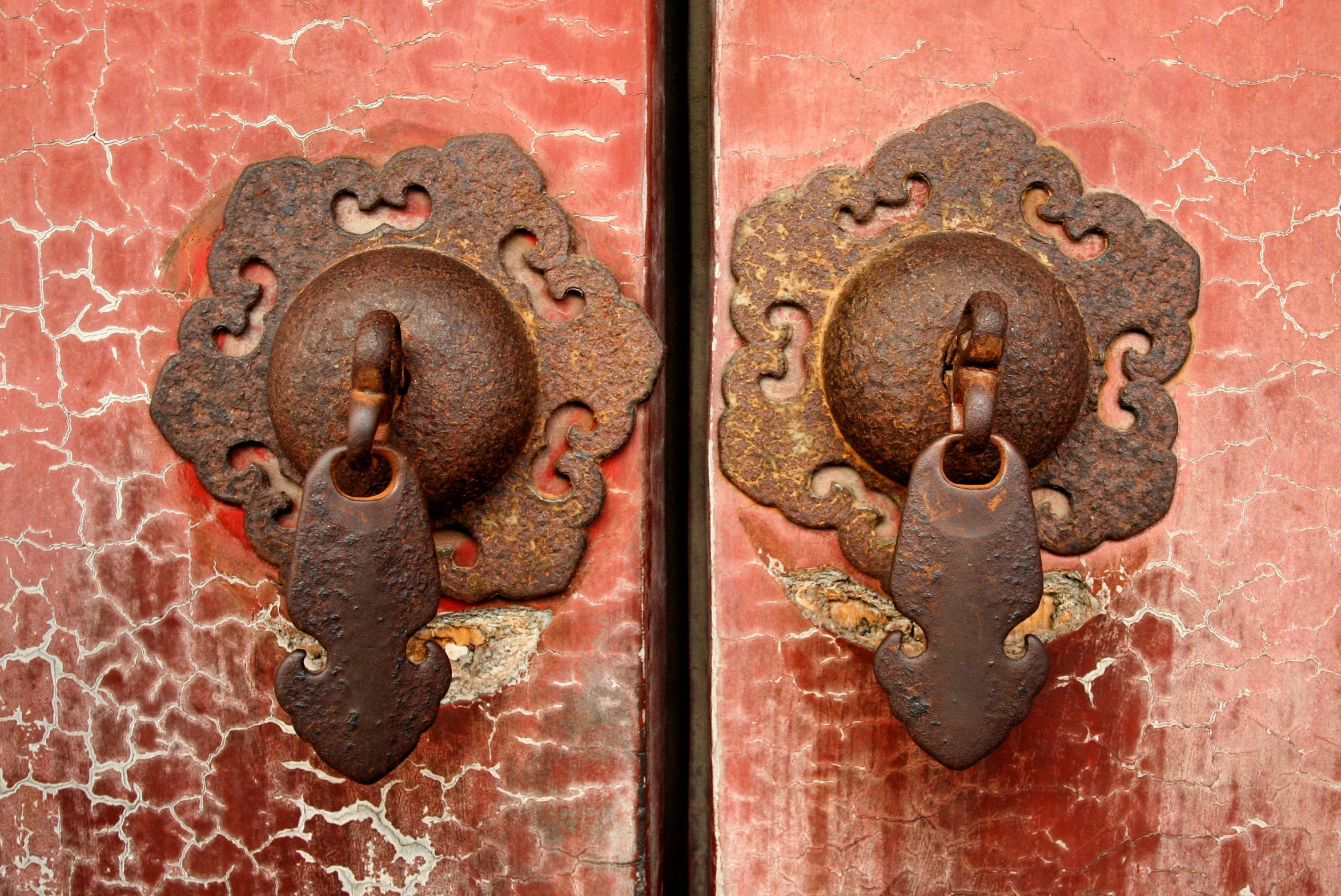 two old metal knocklets with small latches