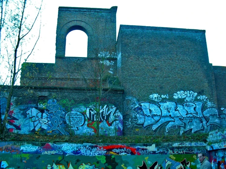 a large old building with graffiti on the walls