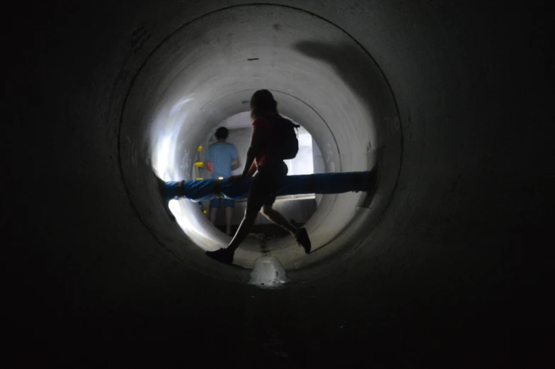 the view from inside of a tube looking at a person