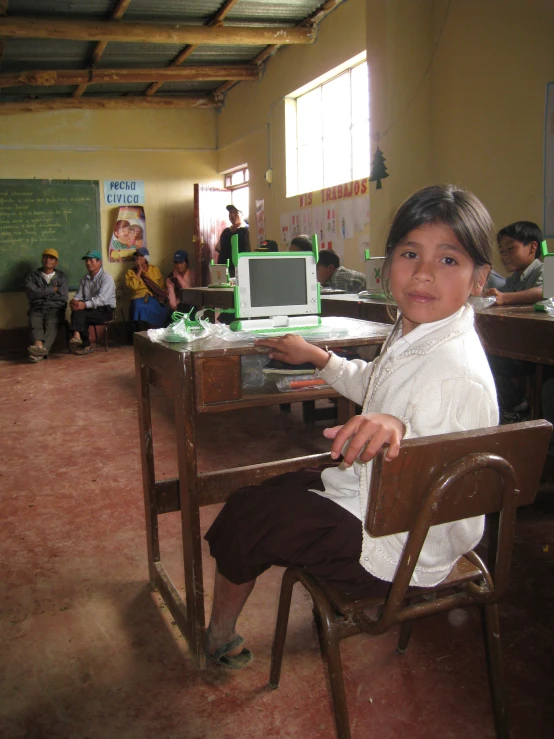 a man is sitting in a chair looking at the camera