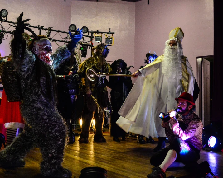 a group of people with costumes in a room