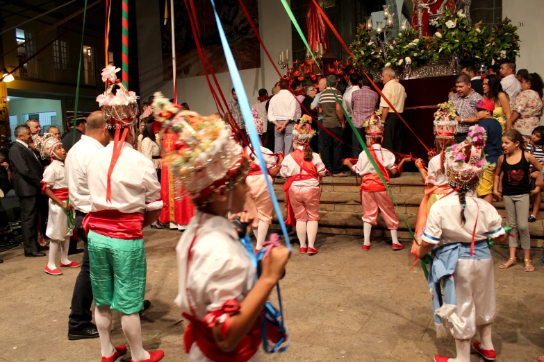 several people in costume stand on a stage