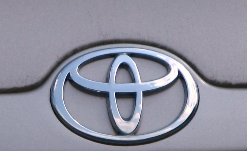 toyota emblem is pictured on the front grille of a vehicle