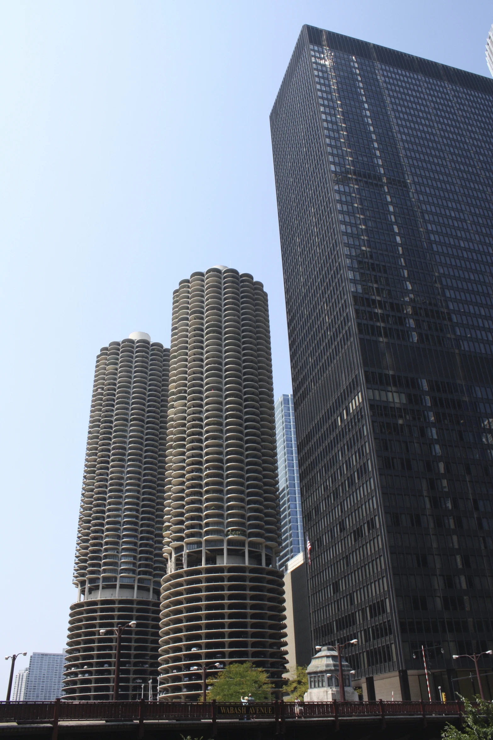 skyscrs stand in the blue sky in an urban setting