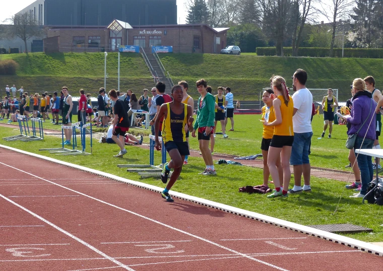 a group of young people are on a track