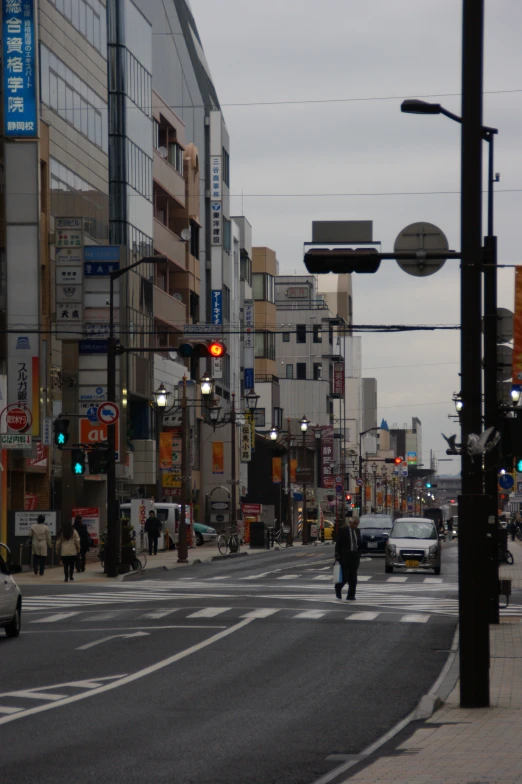 a street view showing a very busy, crowded city