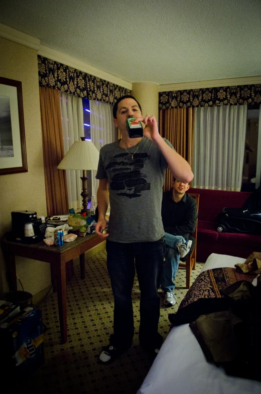 two people in a living room brushing their teeth