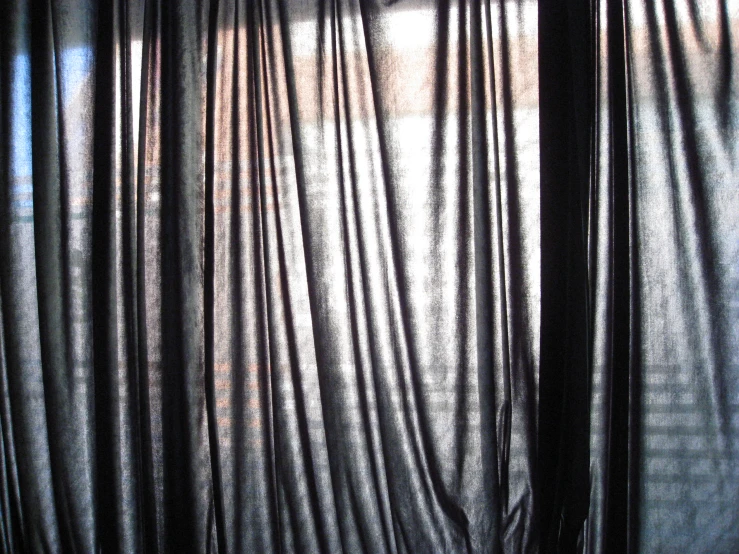 a bedroom scene with the curtain ds and window