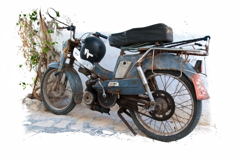 a vintage motorcycle parked next to an ivy covered building