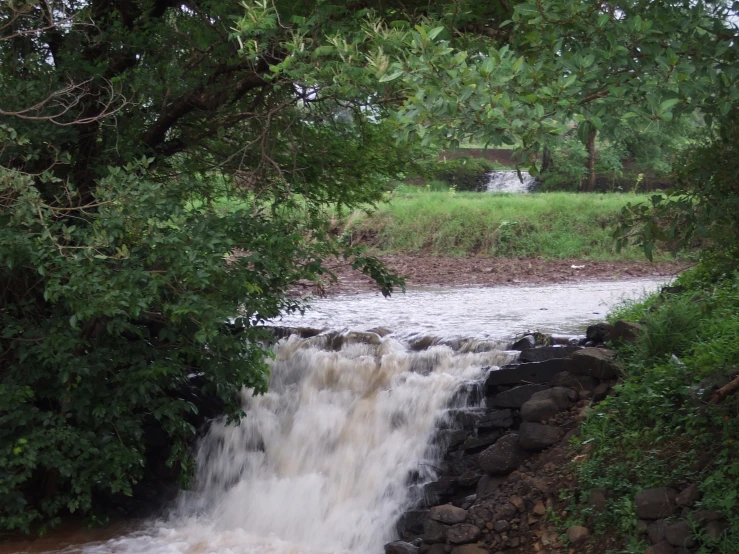 a water source running over a brick wall