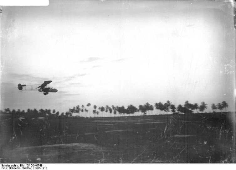 black and white pograph of a helicopter taking off