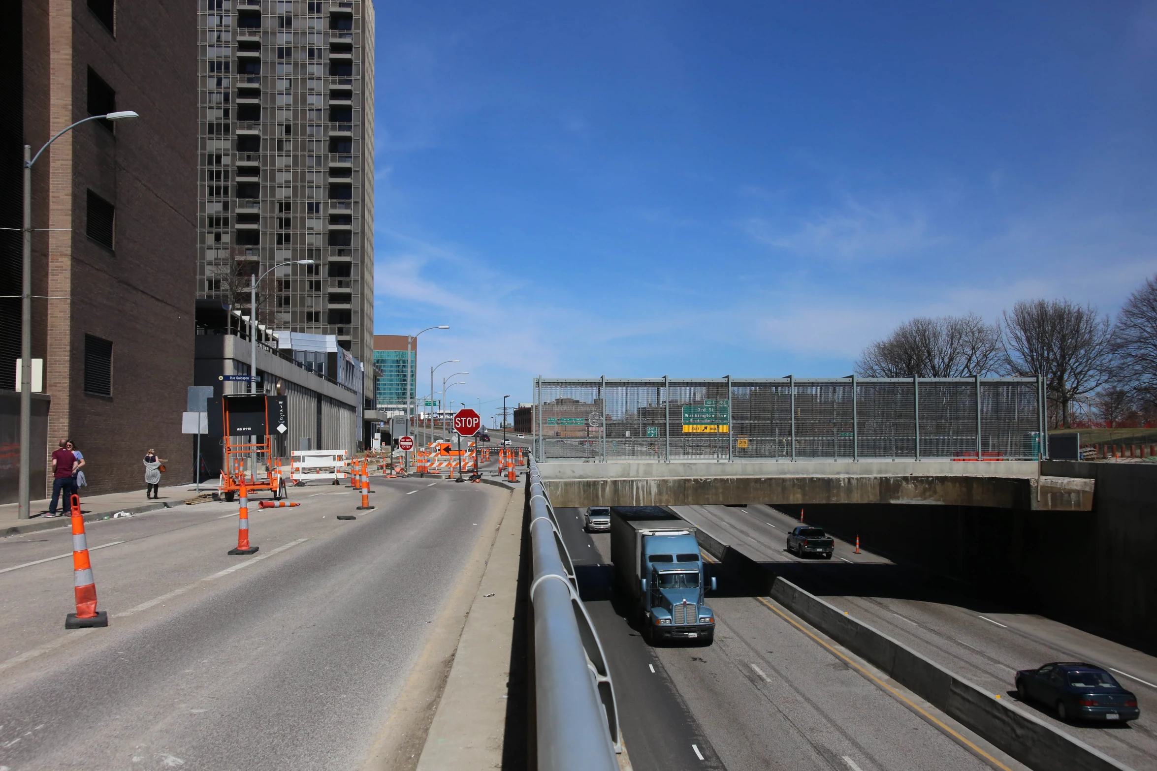 a traffic light with roadwork on both sides in front of an underpass