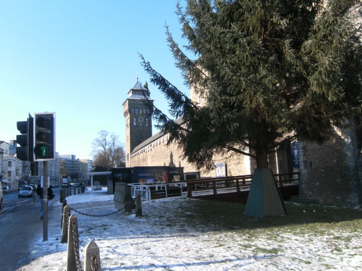 a very large tall clock tower towering over a city