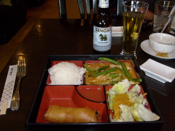 a table with food, drinks and paper plate