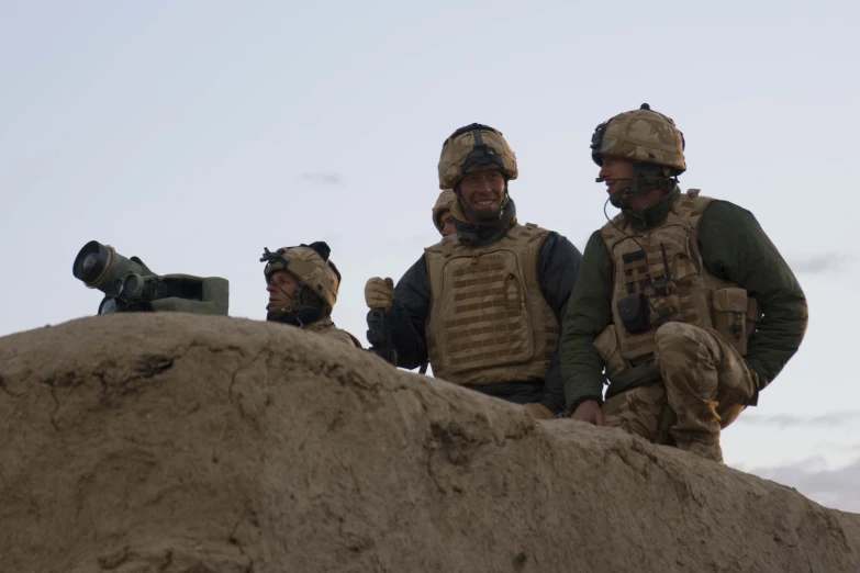 a group of men in full military gear stand next to each other