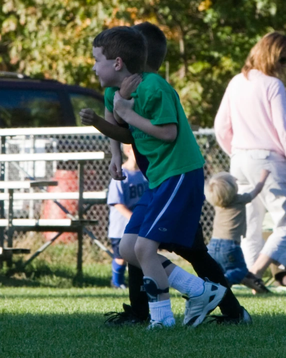 some young children playing a game of soccer