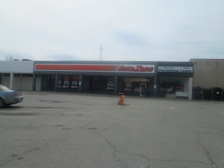 the car showroom has cars parked and it is empty