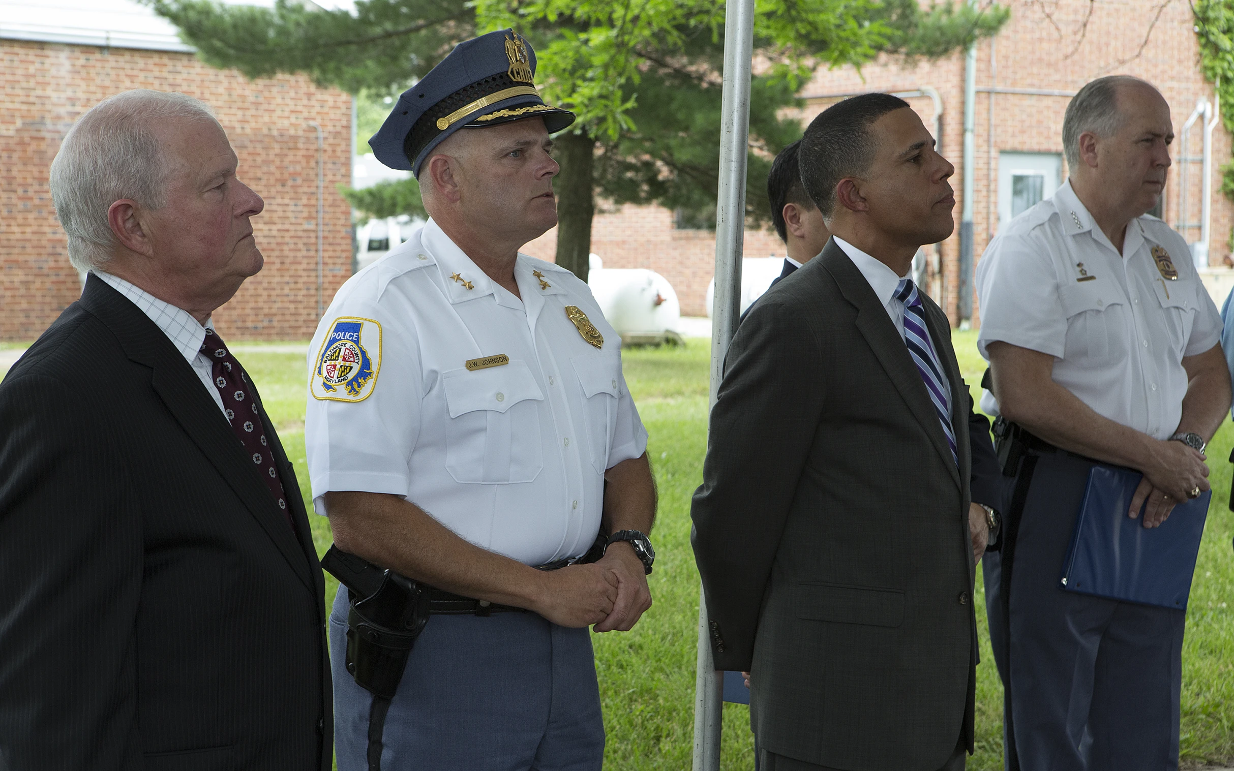 three military men standing next to one another