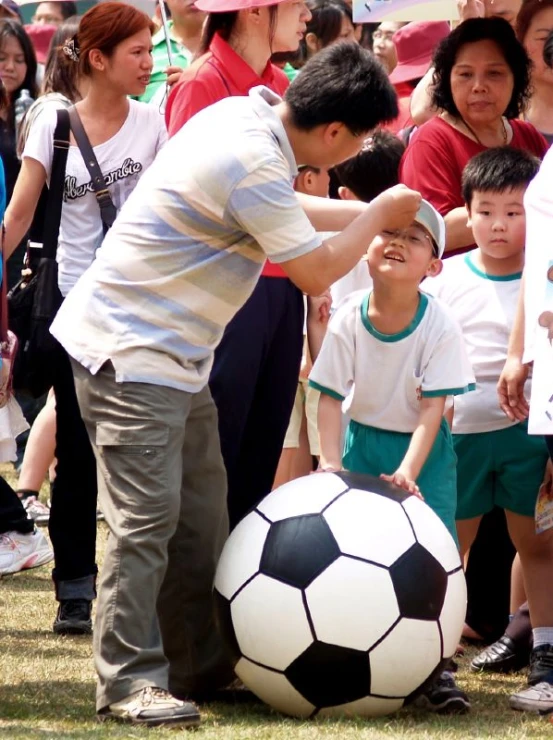 a man on a field with a soccer ball