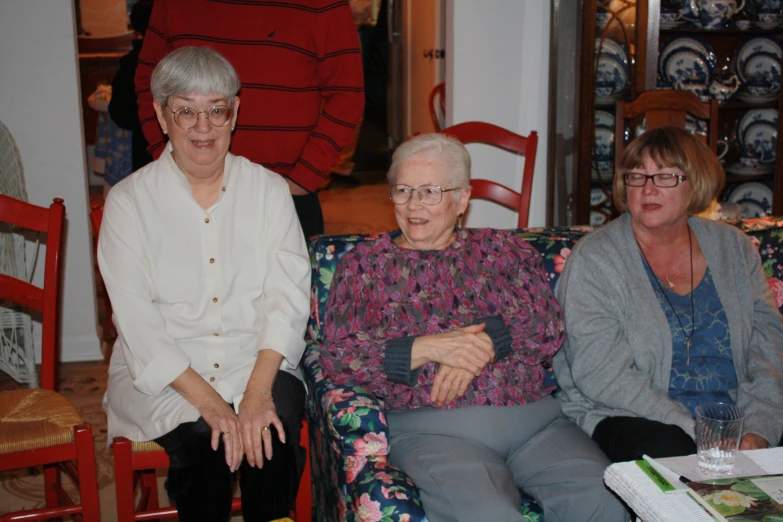 a group of women sit next to each other
