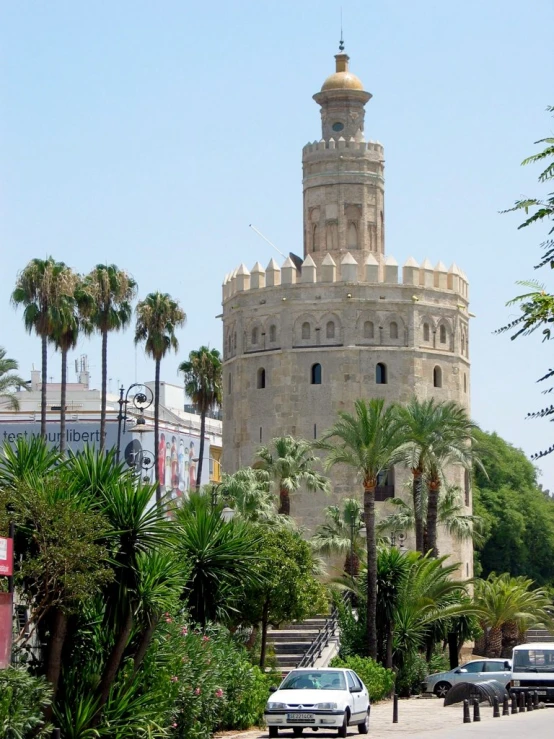 the large tower of the building has a small clock