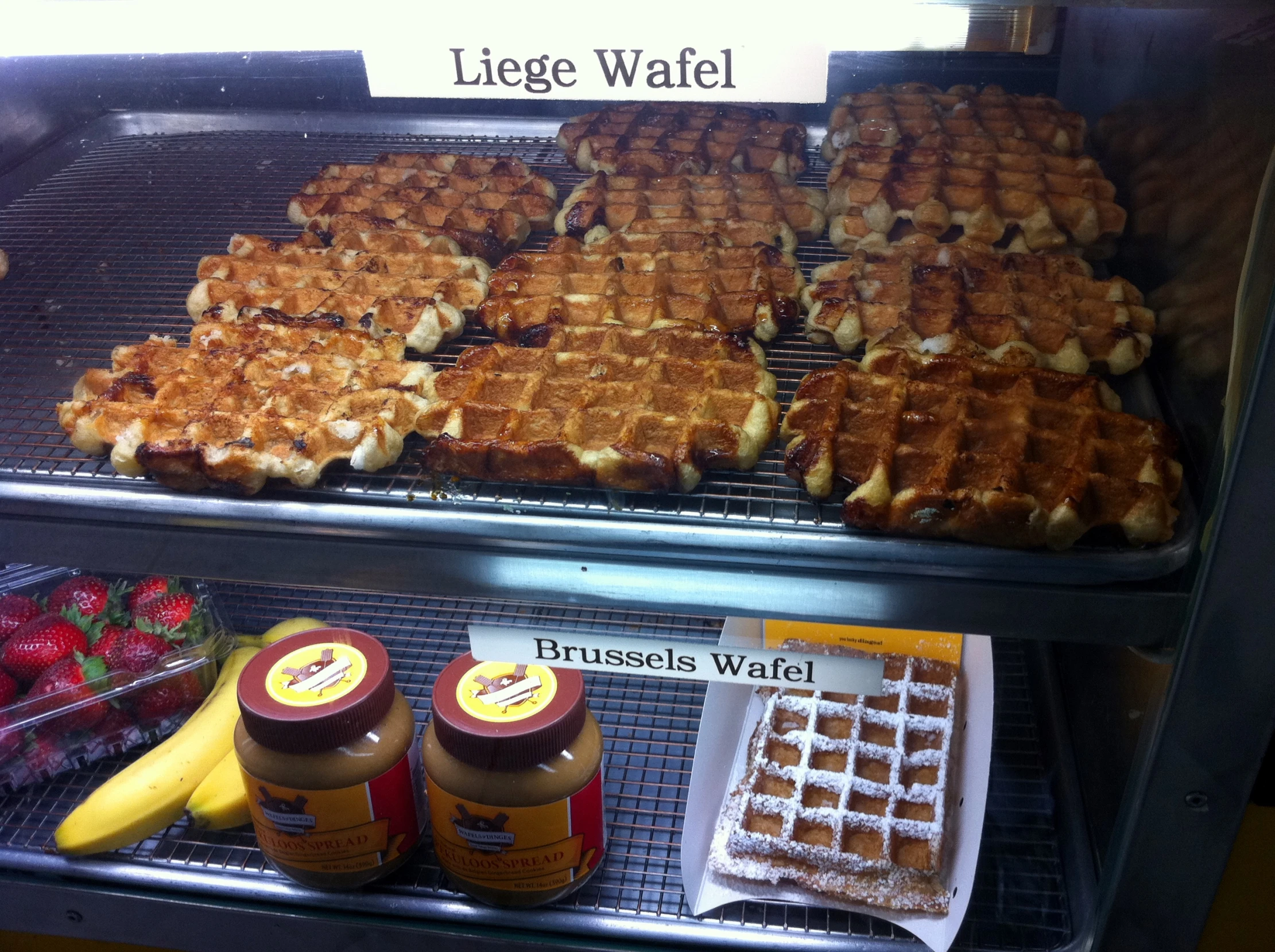 a display in a store with some waffles and fruit