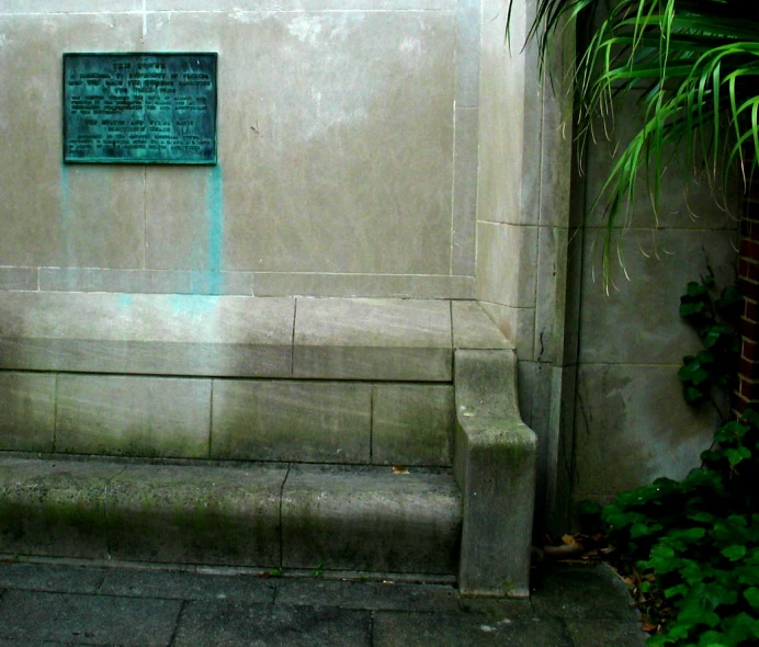 a cement wall with a green marker on it