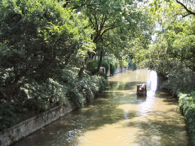 a boat that is traveling down some brown water