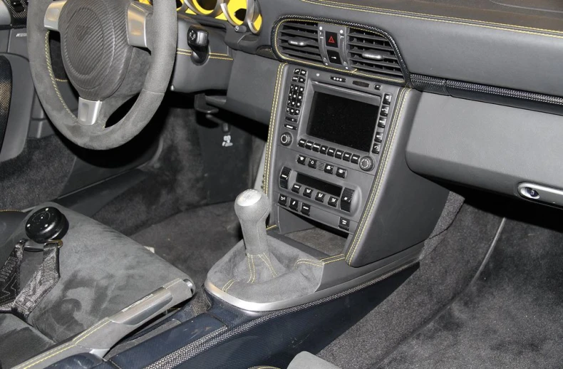 an interior view of a car with various instruments and dashboard controls