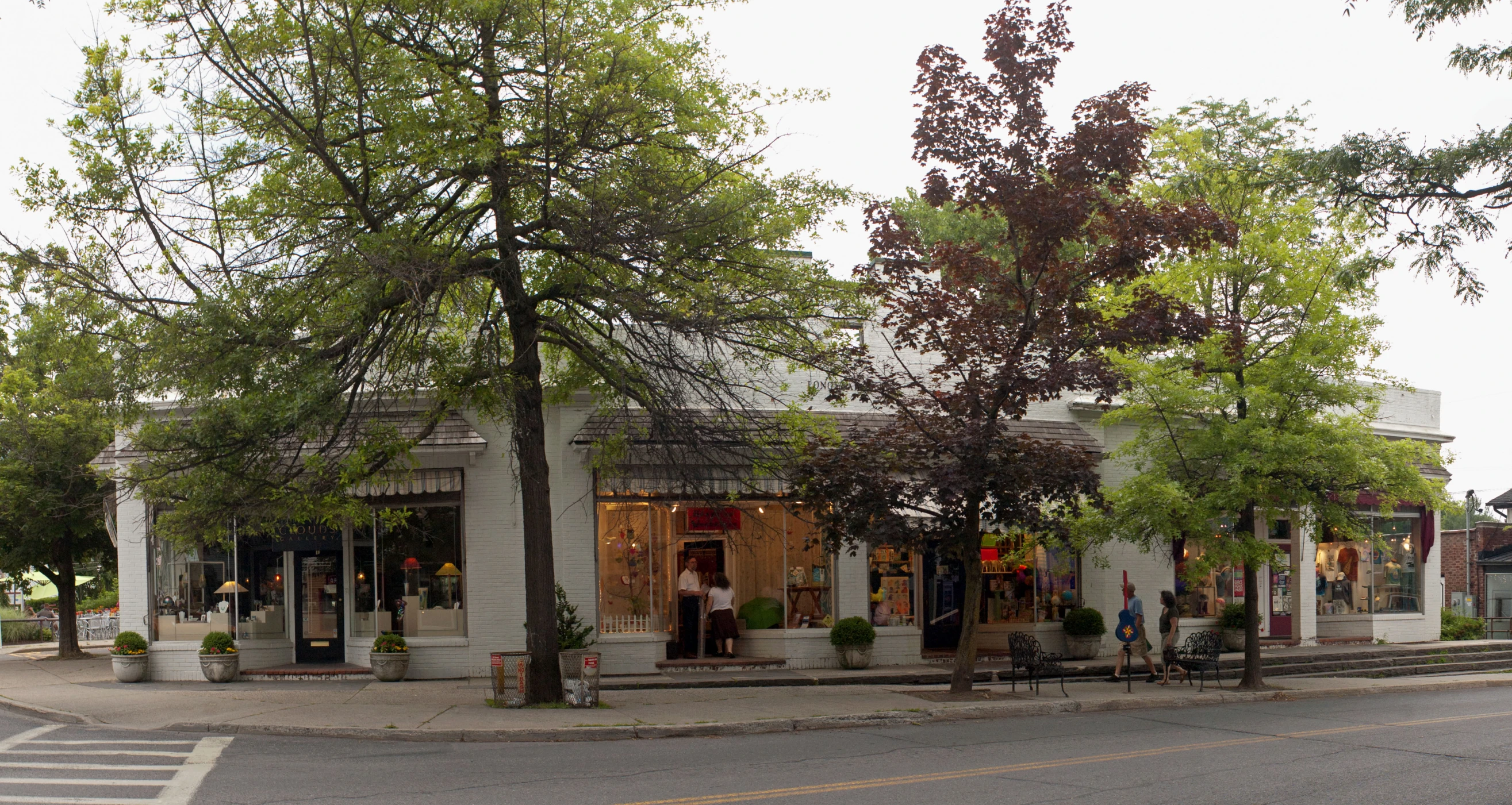 some shops that are on the side of the street