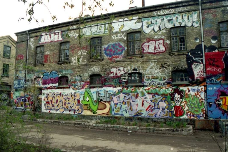 a very old building with some graffiti on it