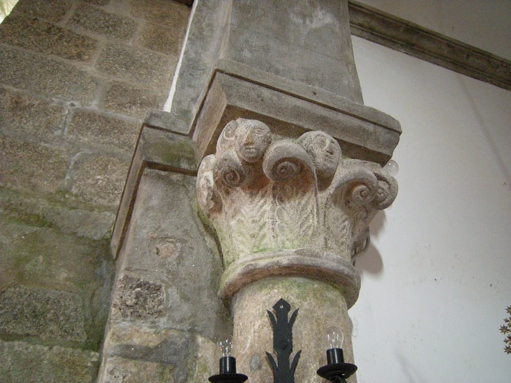 a sculpture of an old fashion hand made of cement