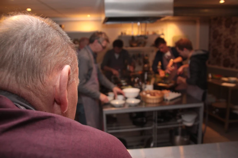 a man in front of a large group of people