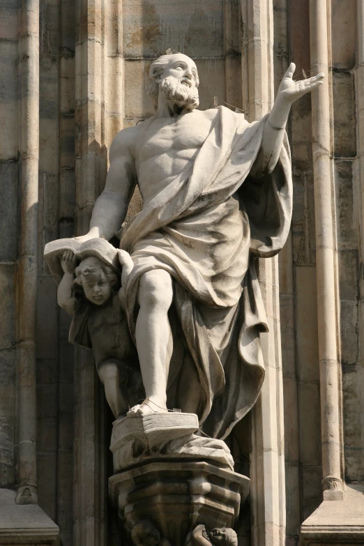 a statue on the side of a building