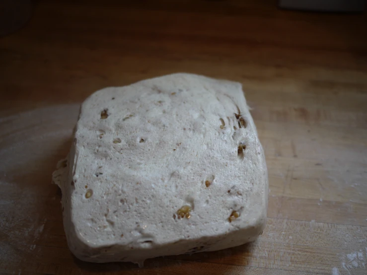 the slab of white bread is on the counter