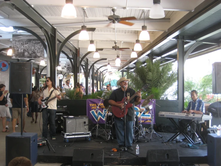 an outdoor concert with a band playing