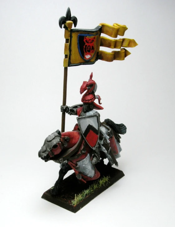 a miniature knight riding on top of a horse