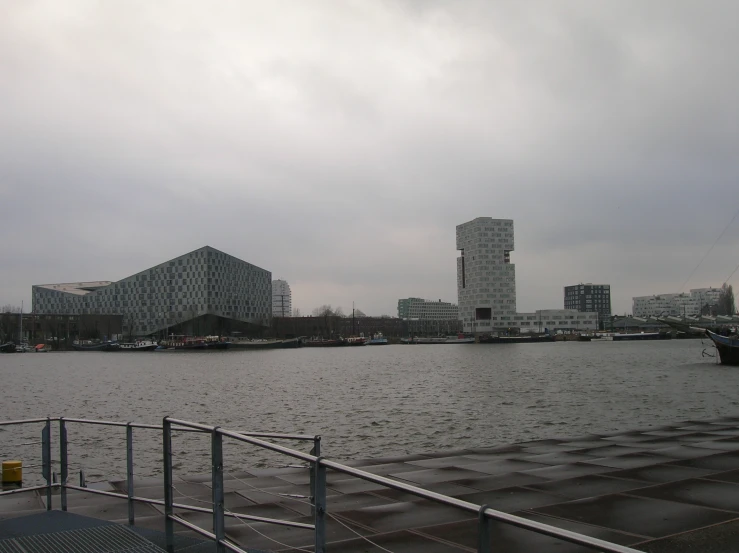 a boat on a body of water with buildings in the background