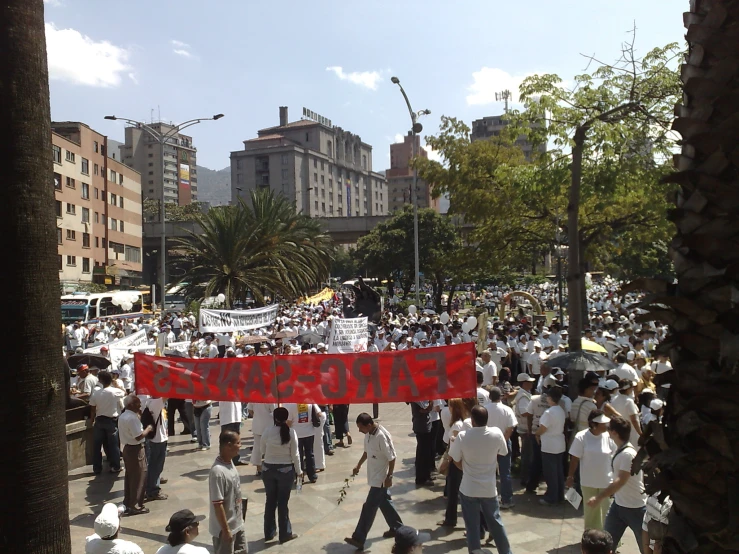 a group of people that are holding a red sign