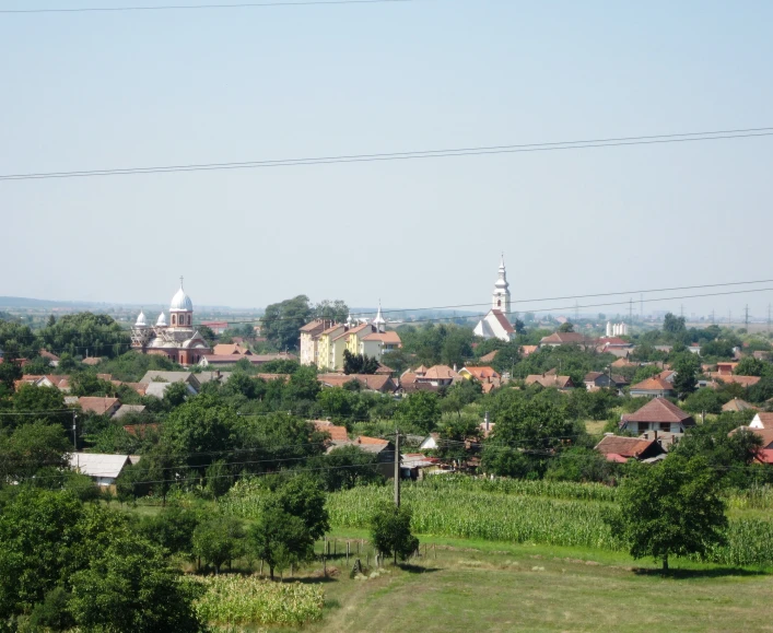 a rural town in the distance in an open country