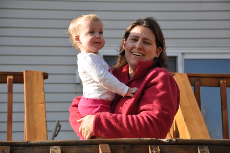 a woman and a baby posing for a po