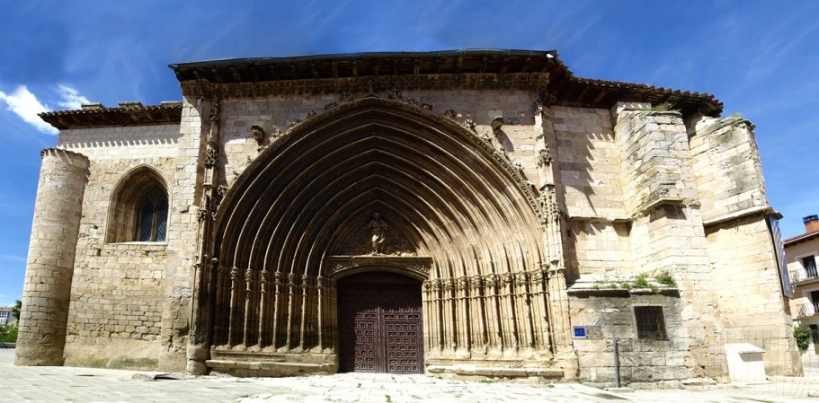 an ancient building with a big arched doorway